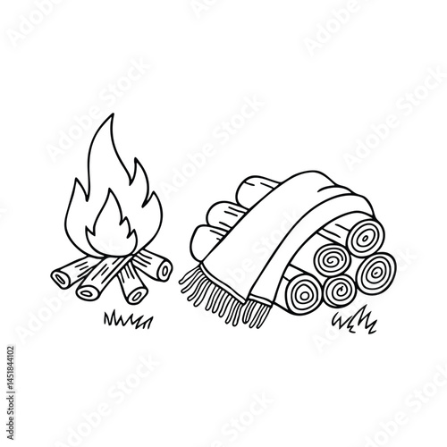 A scarf resting on a pile of firewood next to campfire