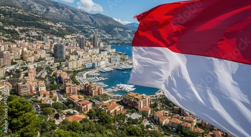 Waving Monegasque Flag Symbolizing Glamour and Heritage Against the Azure Mediterranean Sea Coastline