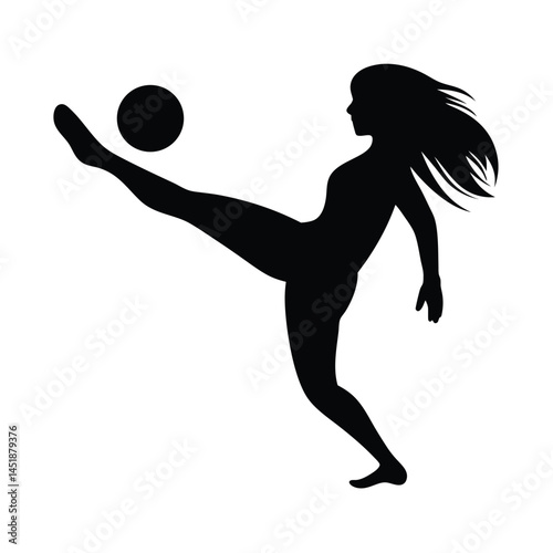 Silhouette of a young girl playing soccer, kicking the ball