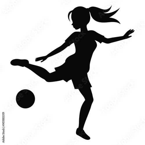 Silhouette of a young girl playing soccer, kicking the ball