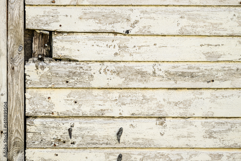 Naklejka premium Aged wooden wall with peeling paint.