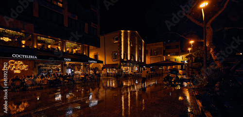 Evening city scene with reinig square. Lloret de Mar, Girona region, Spain. Costa Brava. Mediterranean Sea. Plaça de l`Església