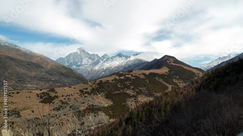 Landscape on the way to Magnificent view of Siguniang Mountain (Four Sisters) on a cloudy day in Sichuan Province, China. 