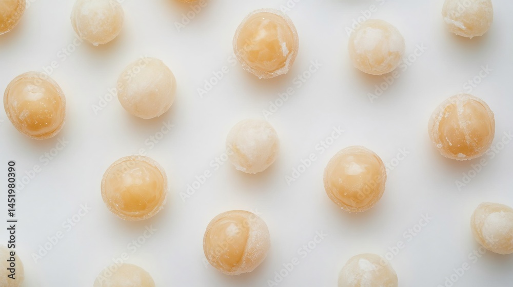 Obraz premium Top down view of peeled whole longan fruits on white background translucent tropical fruit frequently imported to USA for sweet juicy treats and fruit bowls cut out on isolated transparent background