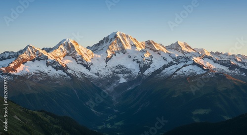 Majestic Swiss Alps at Sunrise: A Breathtaking Panorama of Snow-Capped Peaks