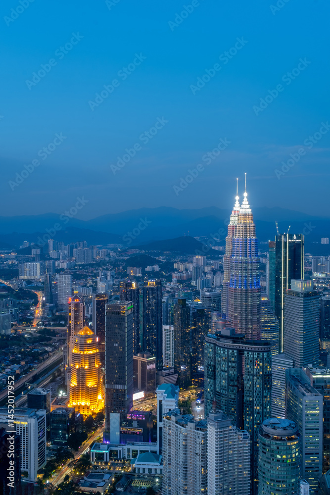 Obraz premium Kuala Lumpur's heart of city centre view during blue hour. The photo was taken from KL Tower.