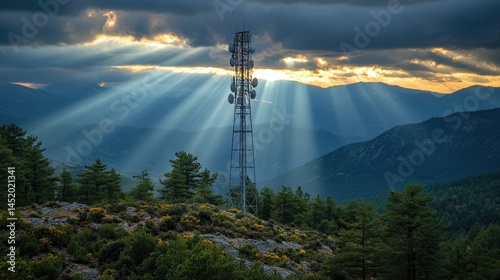 Mountaintop telecommunication tower bathed in sunlight