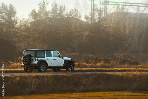 SUV driving through rural landscape
