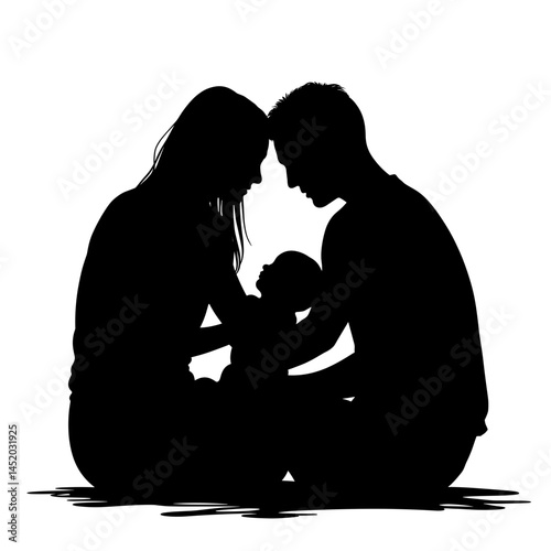 Loving parents embracing their baby in silhouette  