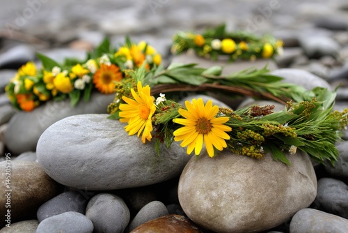 Flower crowns resting on smooth river stones