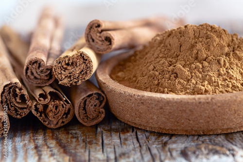 Fototapeta Naklejka Na Ścianę i Meble -  Cinnamon Sticks and Ground Cinnamon.