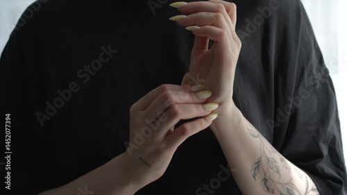 Girl scratching her hands and palms close-up.
Skin problem.
Skin health and allergic reaction close-up