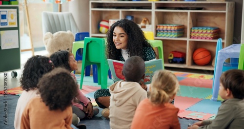 Reading, education and teacher with children in classroom for learning, books and students. Growth, kindergarten and academy with woman and kids at school for youth, story time and child development