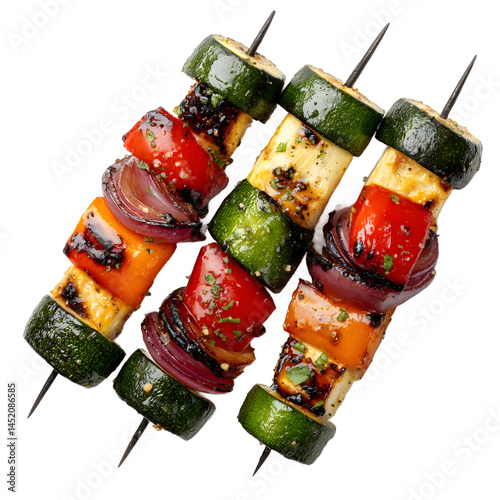Three grilled vegetable skewers featu zucchini, bell pepper, onion, and halloumi cheese are displayed diagonally against a clean white background for a vibrant meal.