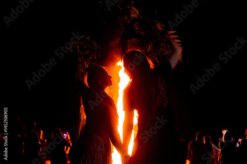 People dance in the firelight on Ivan Kupala
