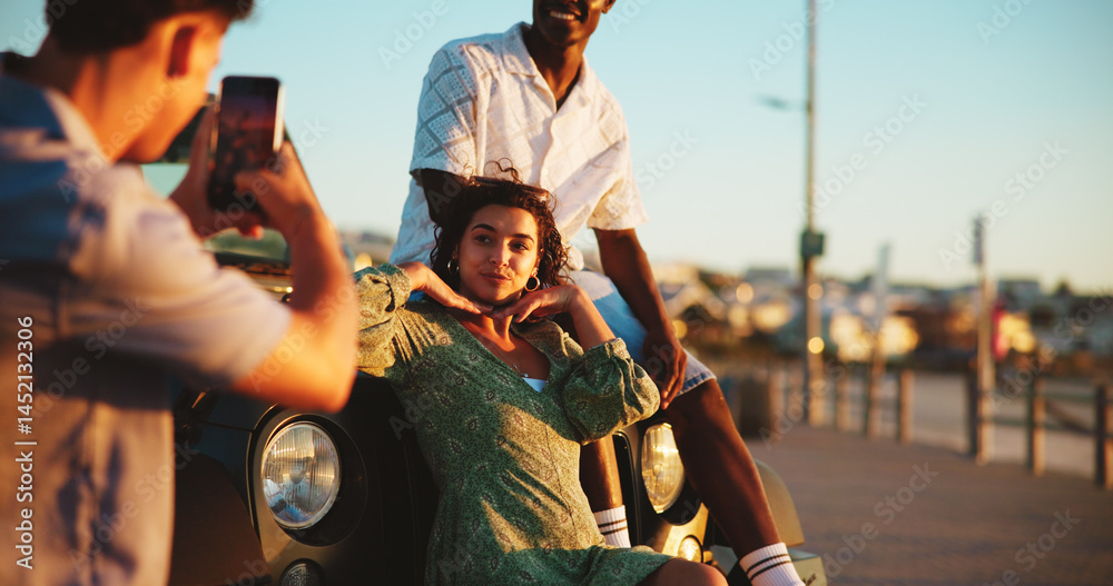Fototapeta premium Phone, photography and friends on road trip with fun holiday, smile and outdoor bonding together. Relax, digital picture and people on car with cellphone, travel adventure or happy memory on vacation