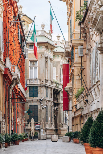 Εκτύπωση καμβά Genoa, Italy - September 22, 2024: Ornate Renaissance palaces and Italian flags line the elegant pedestrian Via Garibaldi in the historic center