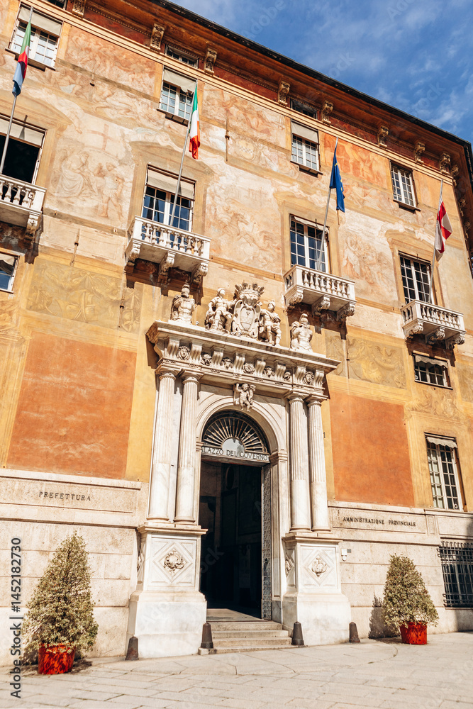Fototapeta premium Genoa, Italy - September 22, 2024: Majestic marble portal with sculpted figures and city crest marks the entrance to Palazzo Doria-Tursi, Genoa’s city hall and UNESCO World Heritage site on Via Gariba
