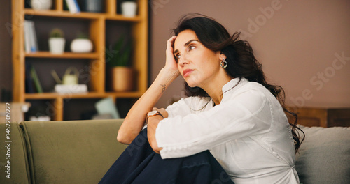 Obraz na plátně Thinking, sad and woman in home on sofa with anxiety for issue, depression and reflection in living room