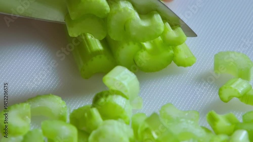 Food preparation. Close-up of slicing leeks. Slow motion footage 100fps.