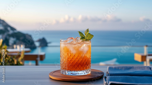 A cocktail at the beach with the ocean in the background.