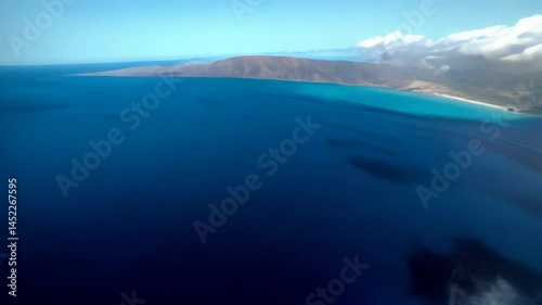Wallpaper Mural Aerial view of turquoise ocean water surrounding tropical islands with white cloud formations during the day Torontodigital.ca