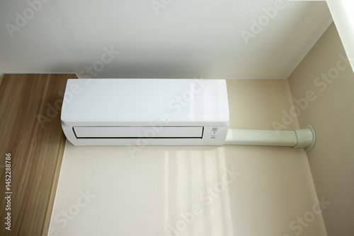 Air conditioner wall mount indoor unit. Part of air conditioning HVAC split system for climate, temperature and humidity control. To cool or cold in room of home building.