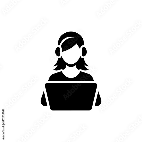 Focused woman works on her laptop at a desk with a potted plant nearby, creating a productive and comfortable workspace. Home office concept