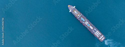 Obraz na płótnie Aerial view luxury ocean cruise ship on clam blue sea, Elegant modern travel lifestyle, Luxury cruise ship liner modern maritime business ocean tourism, Global business cruise ship liner industry. w salonie