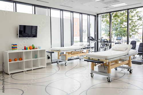 two modern examination tables in a bright and serene medical facility
