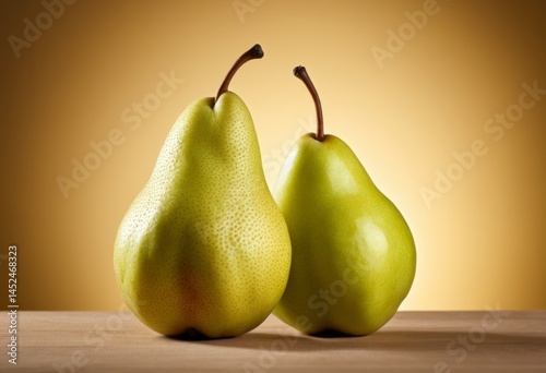 Two pears sit at a table with a brown background
