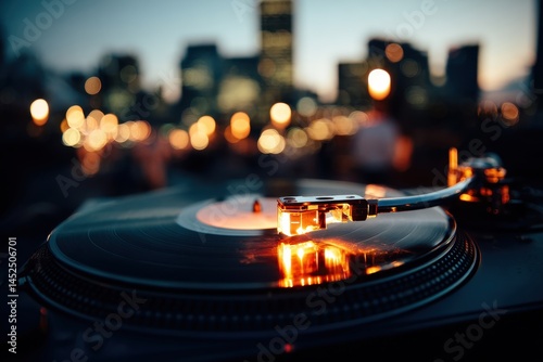 Turntable with City Lights in Background at Dusk