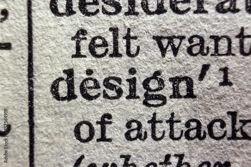 Word design printed on a dictionary page, macro closeup