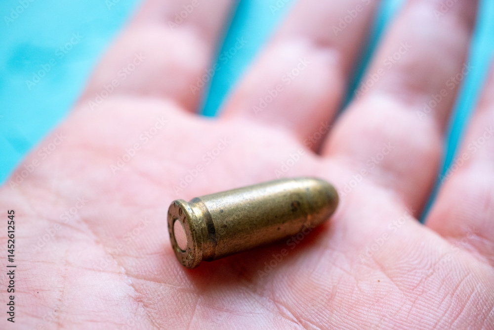 hand holding a bullet
