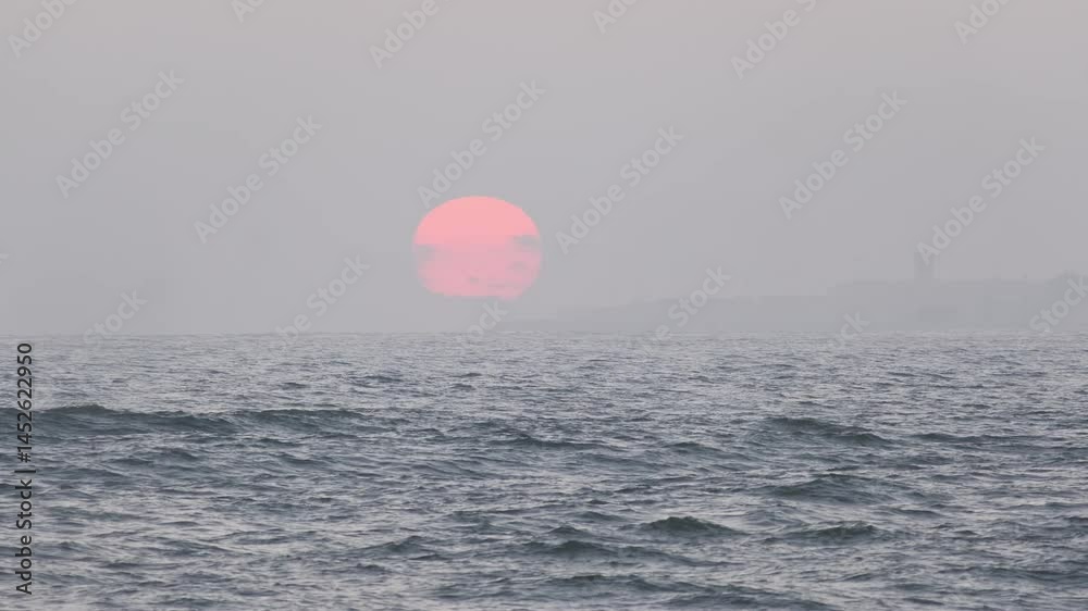 Vibrant pink sunlight glowing over dark blue ocean waters, creating rippling waves and serene coastal atmosphere in portugal Vibrant pink sunlight glowing over dark blue ocean waters, creating rippling waves and serene coastal atmosphere in portugal
