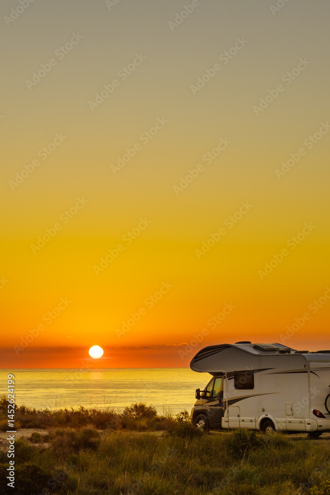 Fototapeta premium Caravan on sea at sunrise.