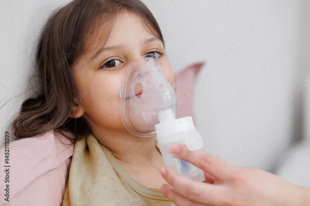 child is sick in bed. inhalation at home. Mom gives medicine to her daughter. Concept disease, pharmaceutics. child is sick in bed. inhalation at home. Mom gives medicine to her daughter. Concept disease, pharmaceutics.