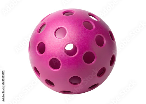 Pink perforated plastic ball isolated on black background for sport or play