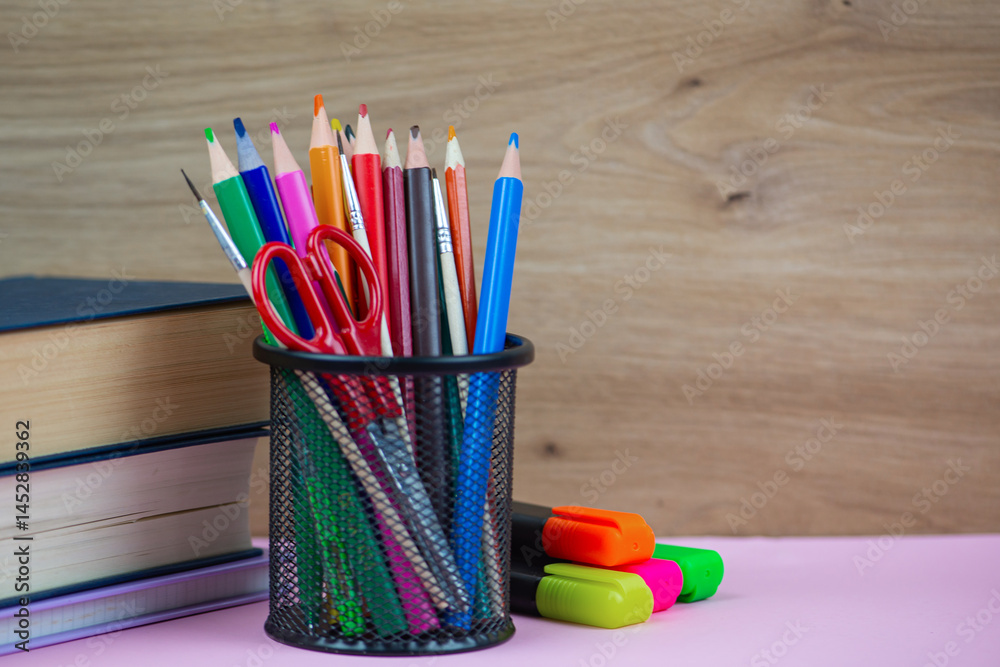 Fototapeta premium A Colorful Stationery Collection beautifully arranged on a Study Desk, showcasing vibrant tools