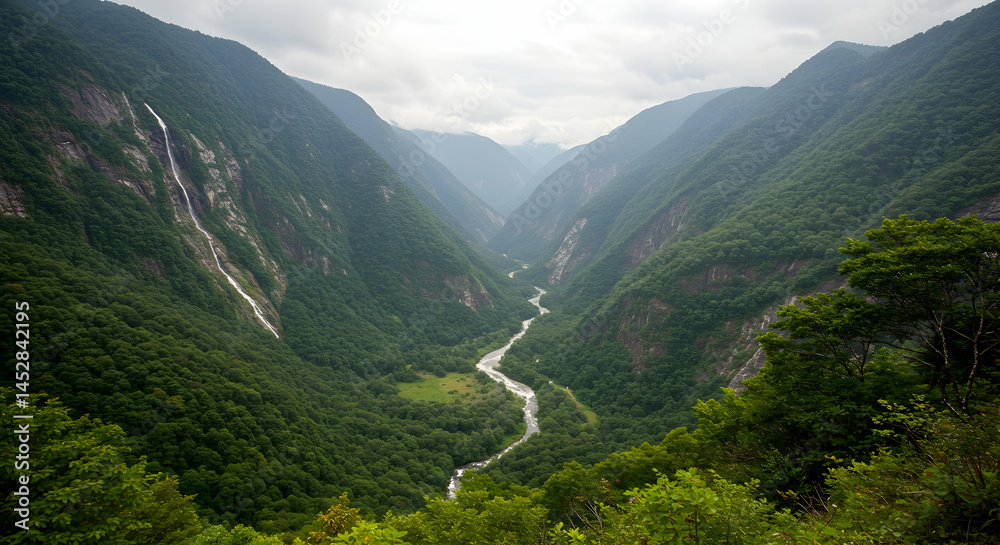 Serene River Winding Through Lush Green Valley Surrounded by Mountains