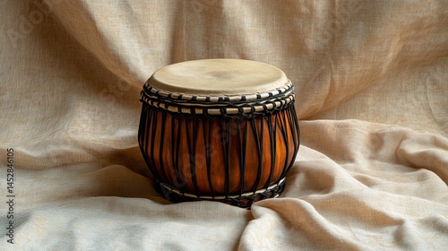 Traditional tabla drum on neutral fabric background photo