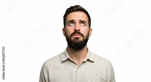Obraz na płótnie Pensive Man With Beard Looking Upwards Against White Background w salonie