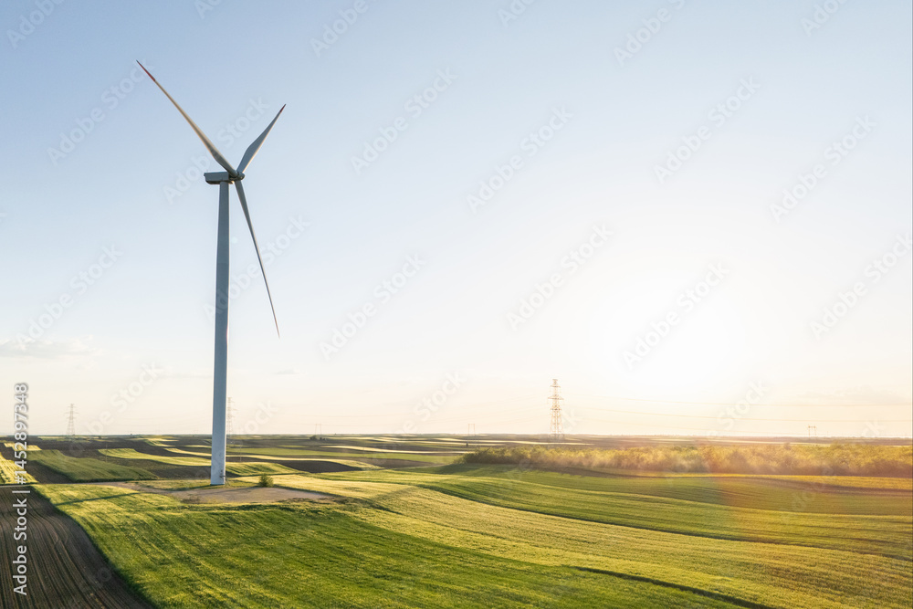 Aerial view of wind turbines on an agricultural field. Sustainable energy Aerial view of wind turbines on an agricultural field. Sustainable energy