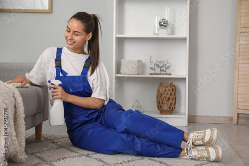 Female janitor cleaning sof...