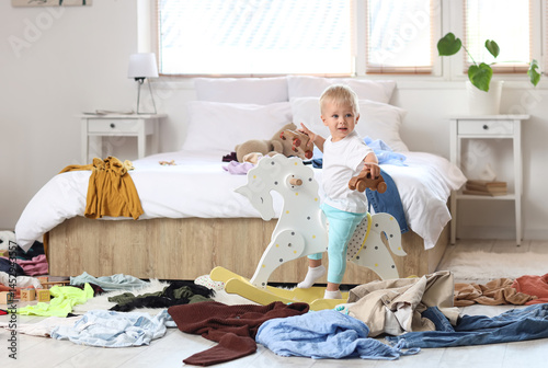 Naughty baby boy on rocking...