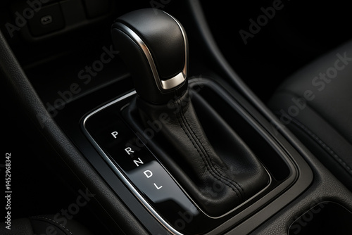 Close-up of automatic transmission gear lever (PRNDL) in a modern vehicle. Sleek, functional interior element for driving mode control and comfort.