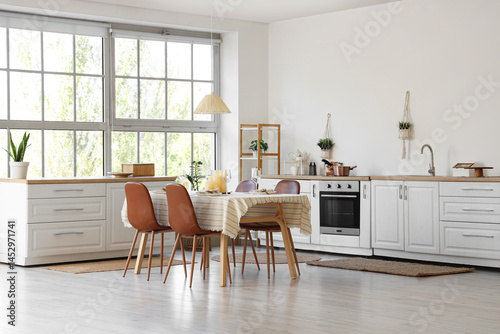 Served dining table with ca...