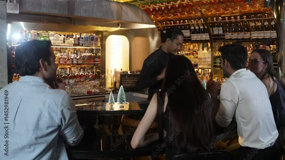 custom made wallpaper toronto digitalSmiling Asian bartender preparing mixed cocktail at decorated christmas tree festive counter bar while talking to VIP guest. Special refresh drink showcasing nightlife at nightclub luxury. Vinosity.