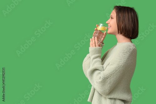Pretty young woman drinking...