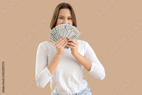 Young woman with dollar ban...